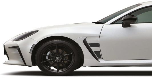 White sports car with black rims on a white background
