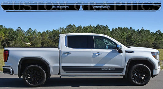 A white GMC Sierra truck with a set of premium vinyl stickers on the side, featuring the brand's logo and design elements.