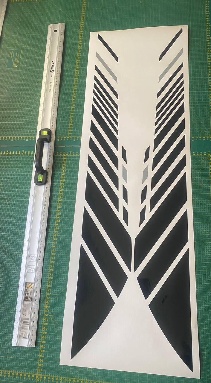 Sticker with geometric design on cutting mat with ruler