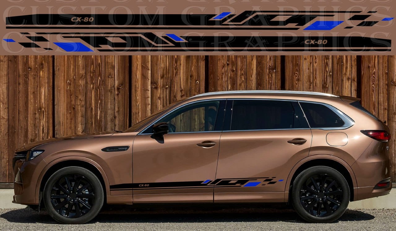Bronze SUV with black rims and custom graphics against a wooden background