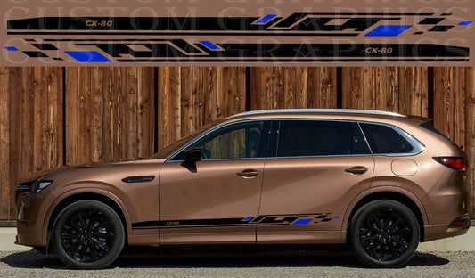 Bronze SUV with black rims and custom graphics against a wooden background
