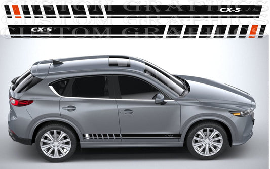 Silver SUV with 'TOM GRIMM' branding and 'CX-5' model on a white background