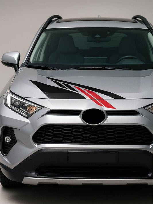 Silver SUV with a black and red stripe on the hood against a gray background