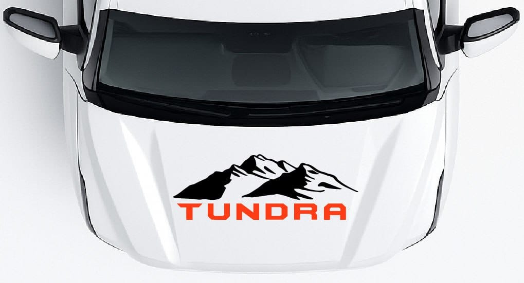 White car with 'Tundra' logo featuring mountains on a white background
