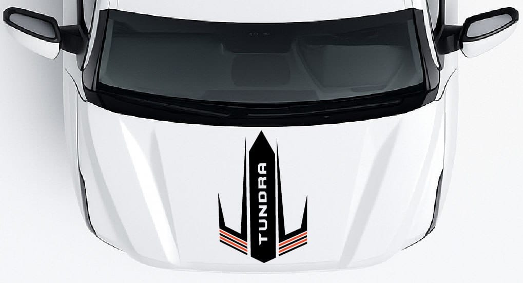 Close-up of a car's front grille with 'Tundra' branding on a white background